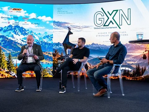 Alistair Mylchreest, Caleb Gilbertson and Maarten Boone on stage at the GXN Annual Conference 2026 in Kitzbühel